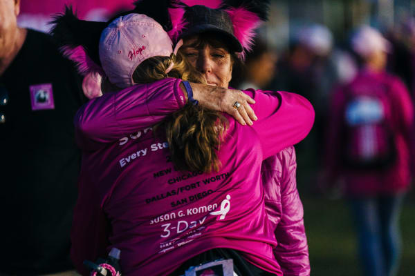 nonprofit members hugging